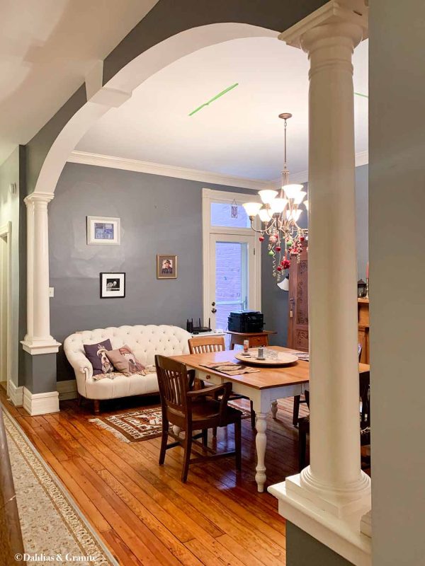 Alternate view of Victorian dining room showing columns and arch detail